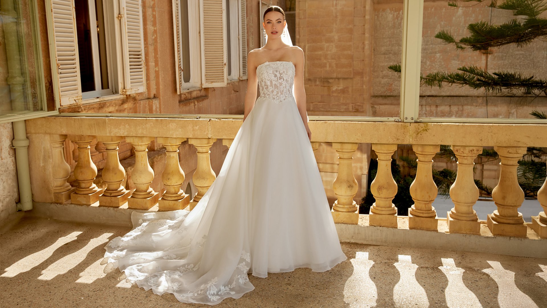 Sincerity Bridal Style 44604 Organza Ballgown with Illusion Bodice, Exposed Boning, and Lace Appliqués on the Circular Skirt and Train