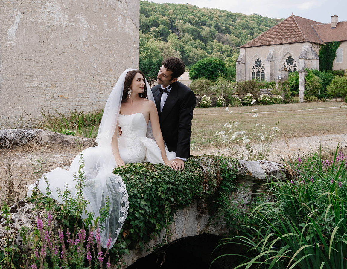 Léanne Ansar at Abbaye de Reigny, 12th-century Cistercian abbey in Burgundy, France, wearing Justin Alexander Signature DICKINSON