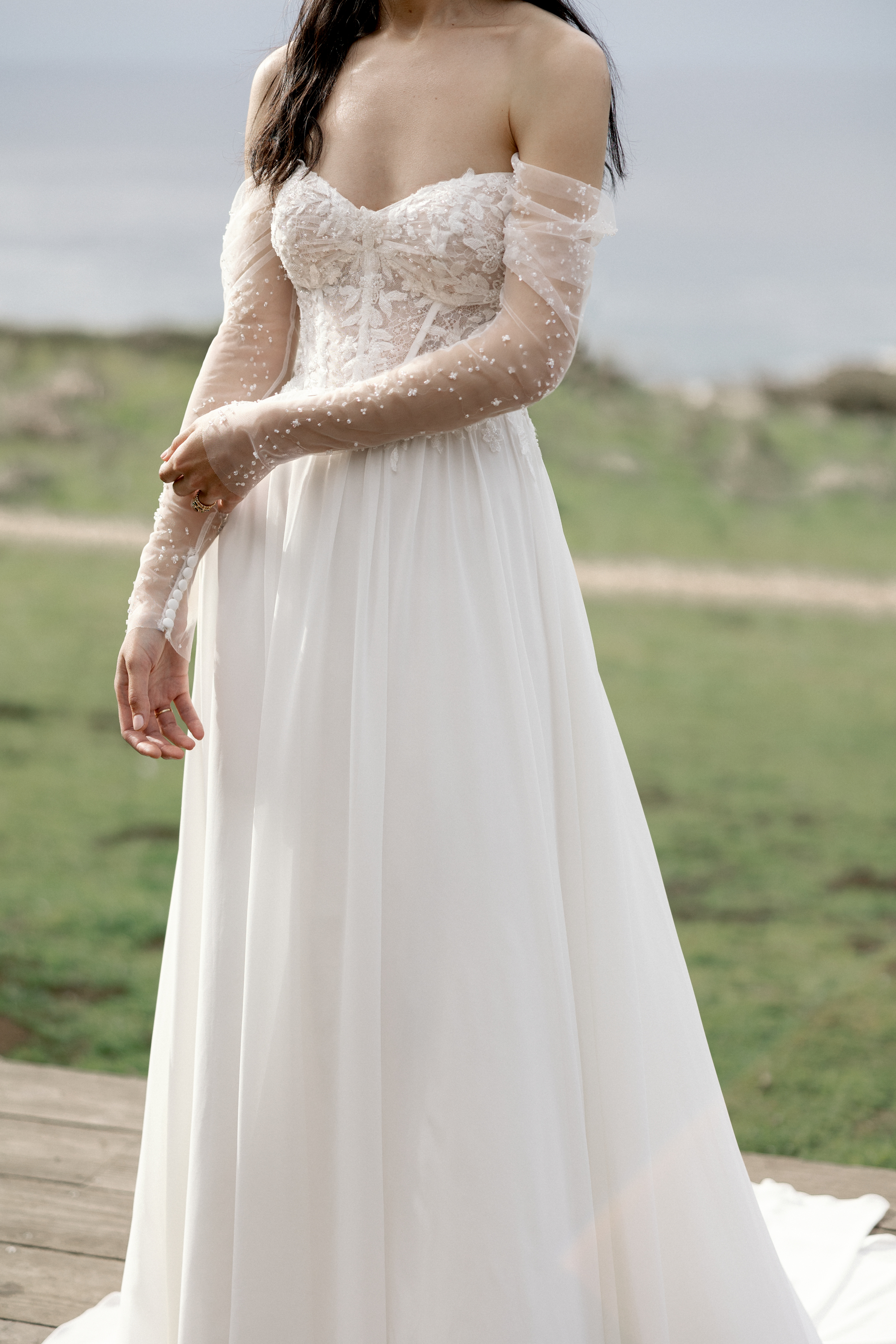 Adore by Justin Alexander Style 11410SL Aurelia Sleeves Detachable Beaded Tulle Off-The-Shoulder Draped Long Sleeves