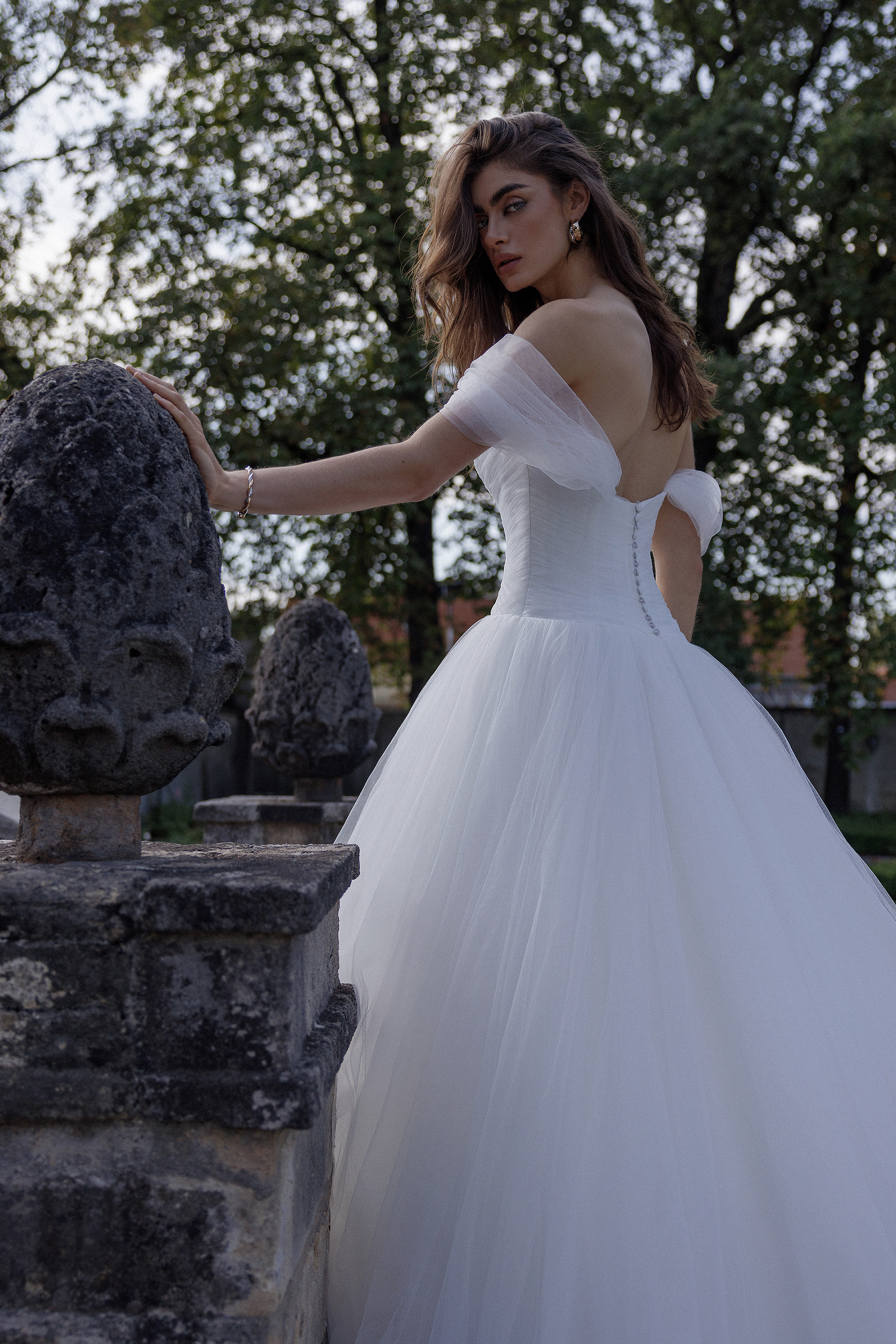 Justin Alexander Style 88384 Ingrid Tulle Ball Gown with Ruched Bodice and Dropped Asymmetric Waistline