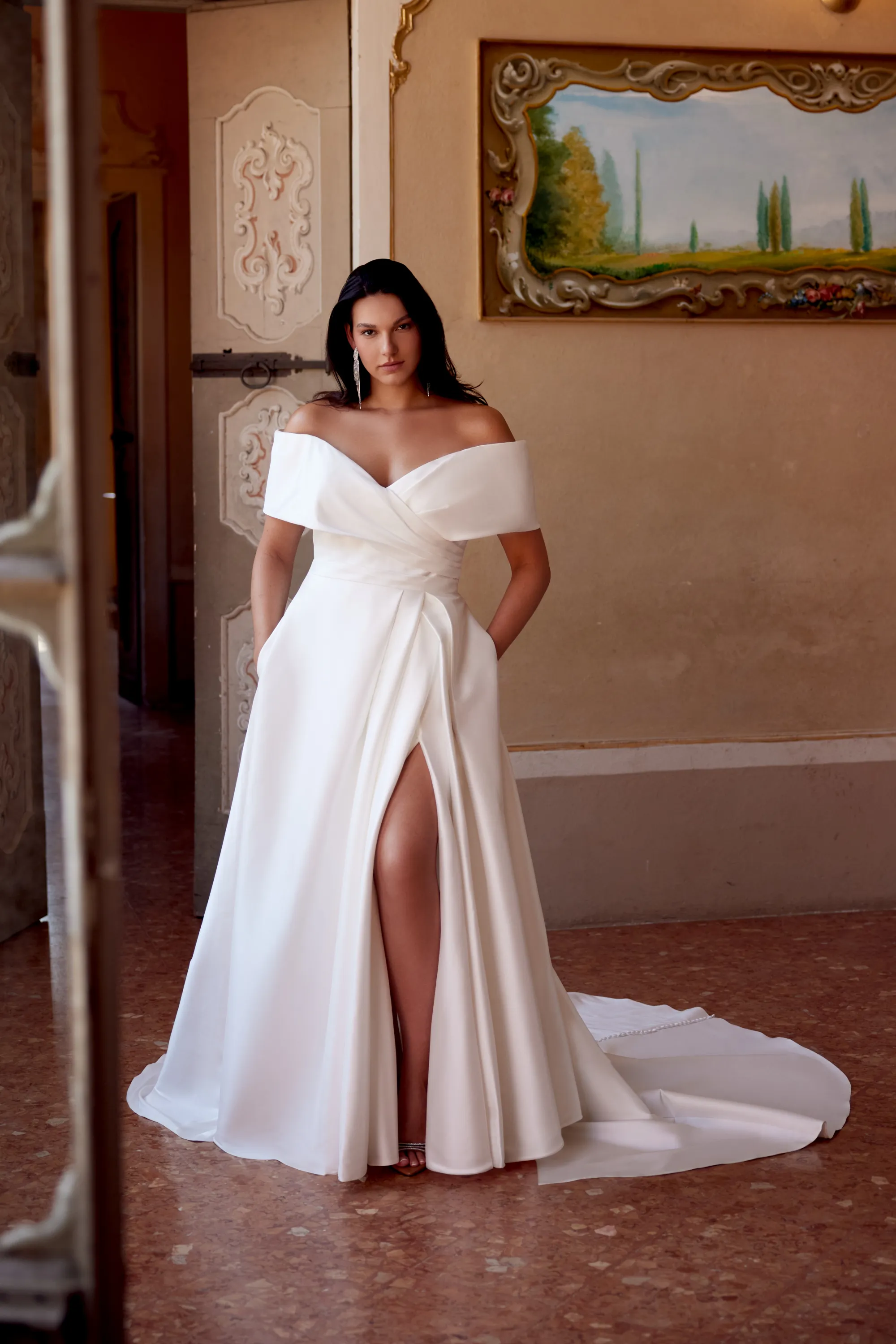 Justin Alexander Style 88354PS Harper PS A-Line Plus Size Wedding Dress with Off The Shoulder Cuff and Skirt Slit