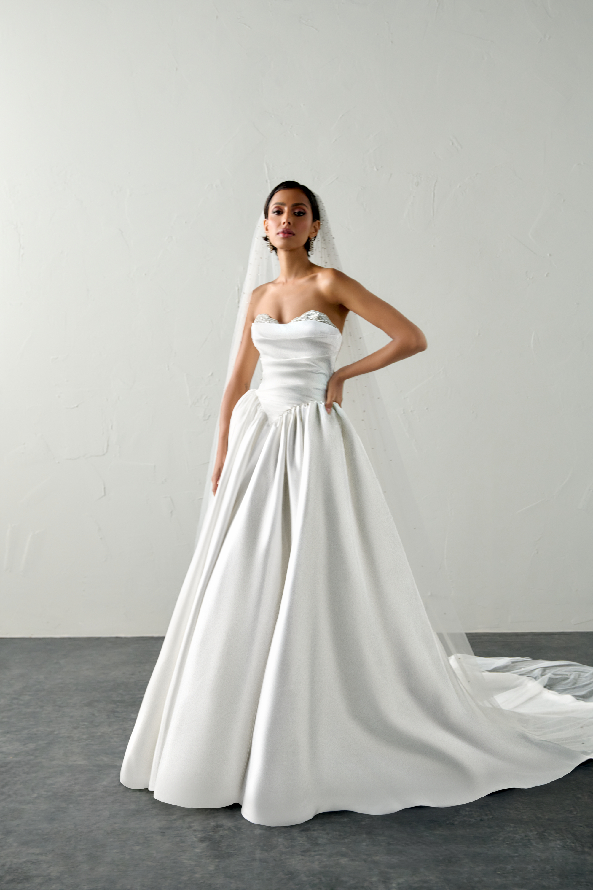 Justin Alexander Signature Style 99398 ECHO Liquid Satin Ball Gown with Crystal Peek-a-Boo Neckline